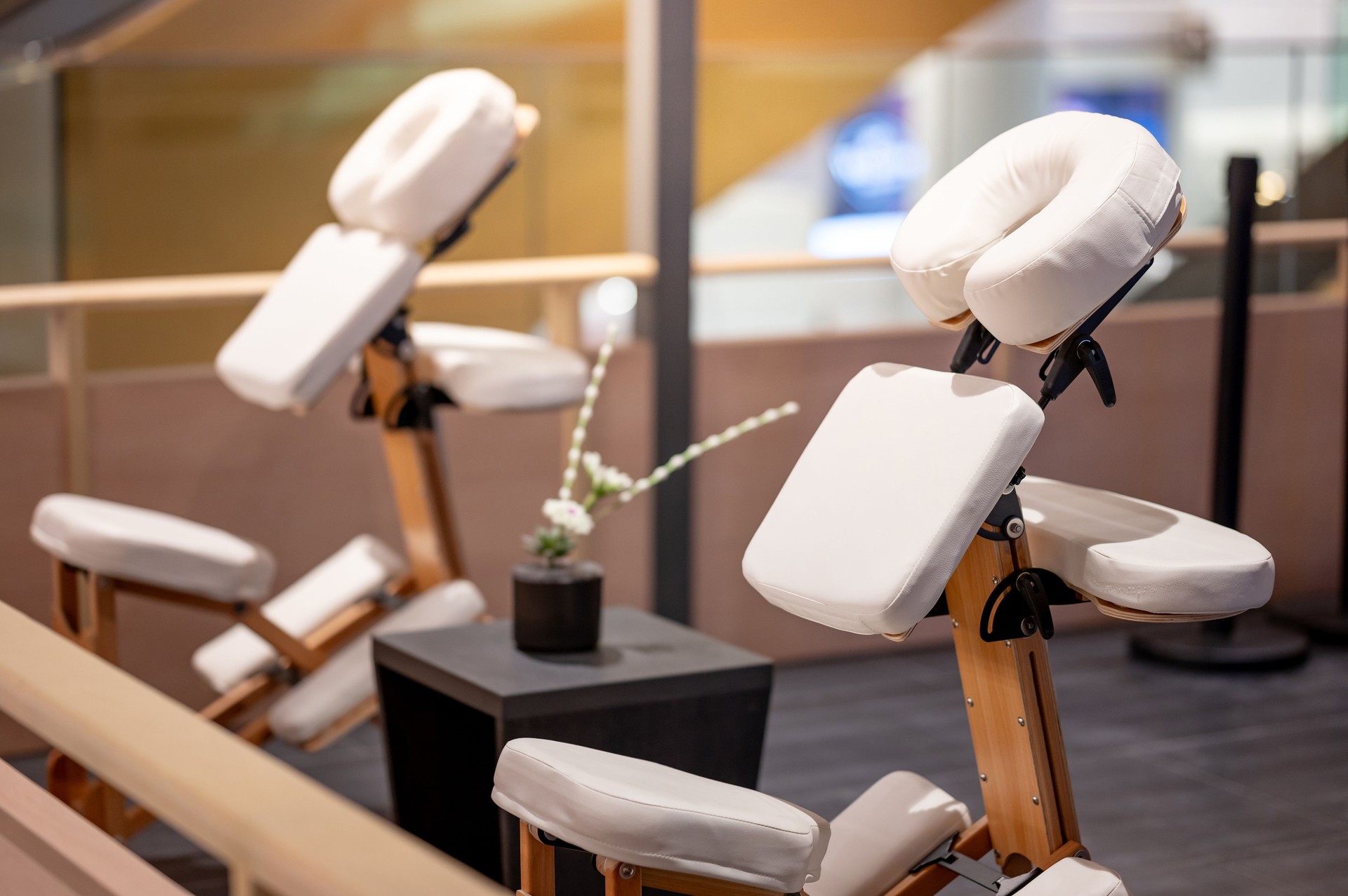 Portable adjustable massage chair in a cozy spa